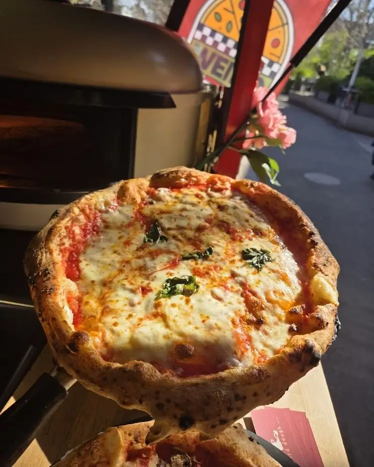 Fresh pizza served at a street food event